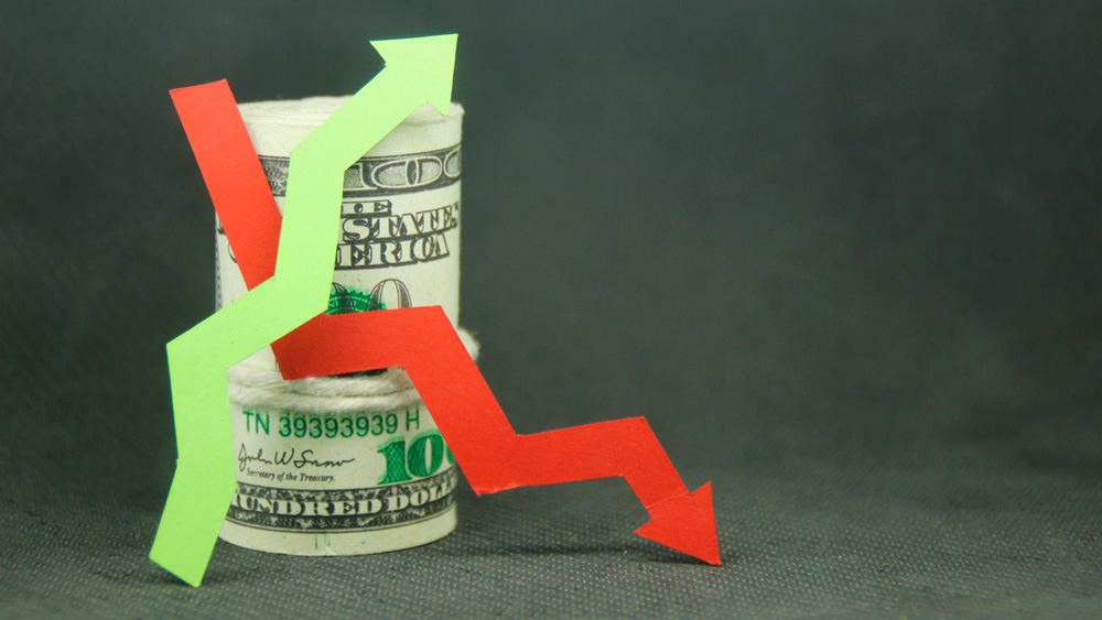 Banknotes with up and down arrows showing investment fluctuations concept