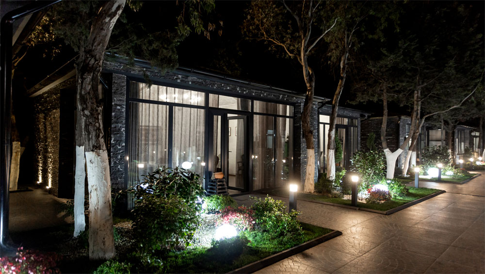 Night view of a peaceful garden suite
